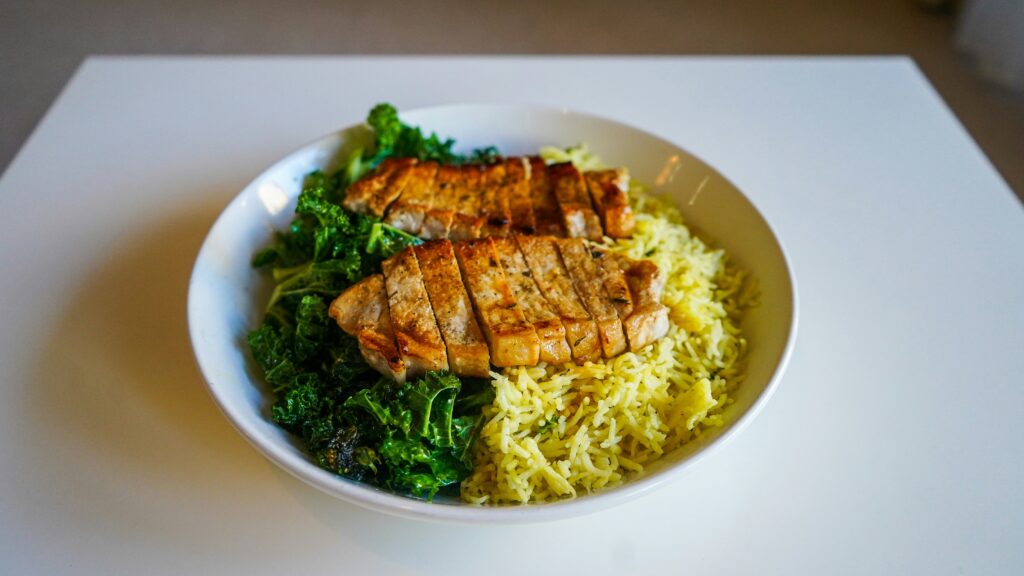 Grilled chicken with rice and kale — pre-run meal for runners