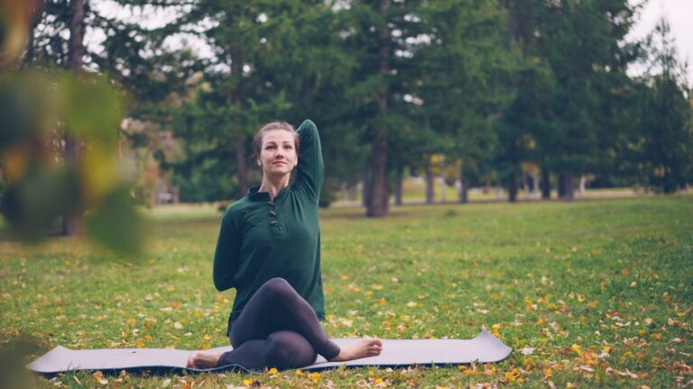runner stretching legs on a park bench after a long run