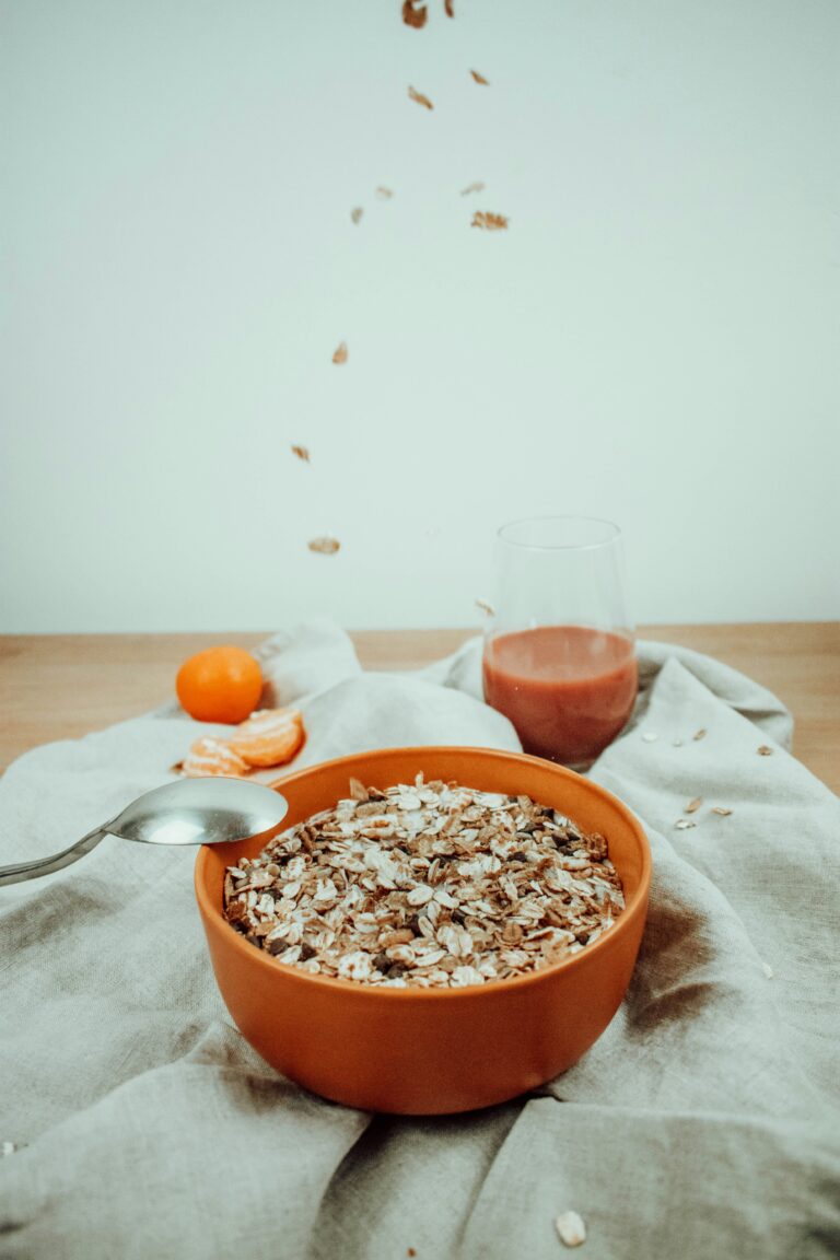 `muesli bowl with orange and juice as pre-race breakfast for runners`