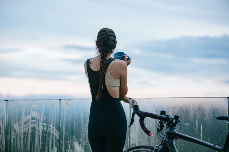 cyclist drinking coffee before a long bike ride